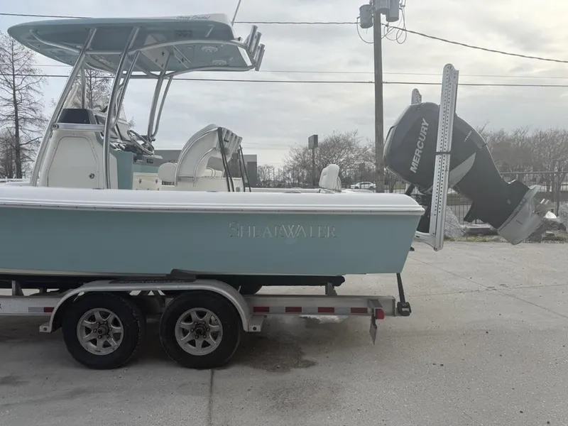 Slide: The Image of 2017 ShearWater 270 Carolina Flare boat on trailer with Mercury engine. - 7
