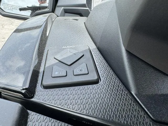 Slide: The Image of 2024 Yamaha WaveRunner VX Deluxe audio controls on textured dashboard. - 10