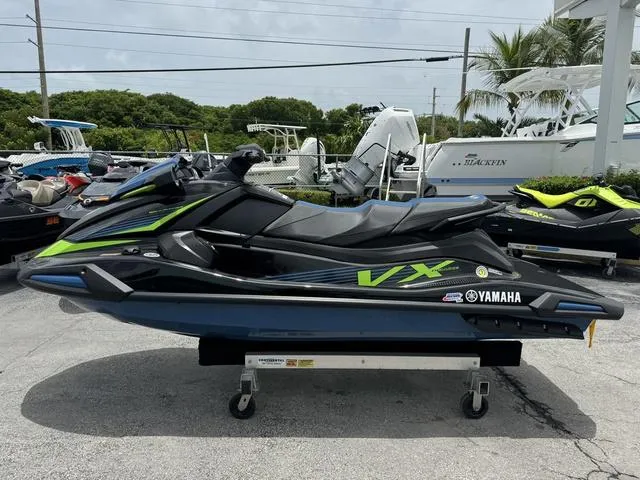Slide: The Image of 2024 Yamaha WaveRunner VX Deluxe with Audio, sleek design, parked outdoors. - 5