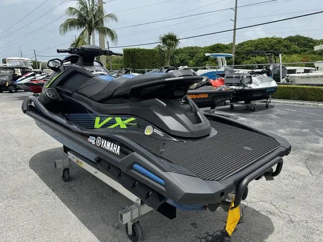 Slide: The Image of 2024 Yamaha WaveRunner VX Deluxe with Audio, parked outdoors on a sunny day. - 6