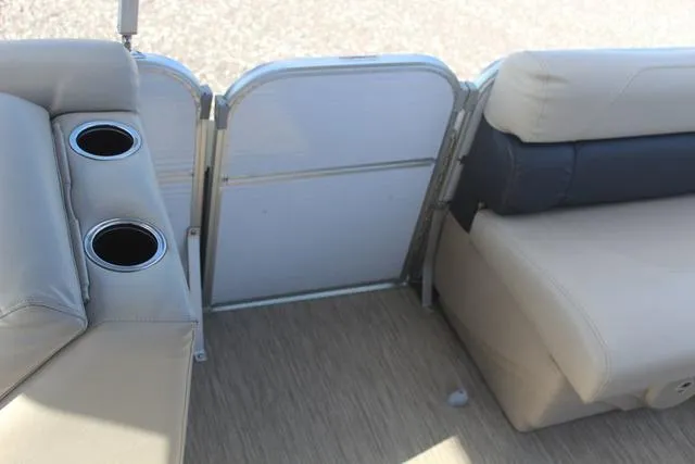 Slide: The Image of 2019 Misty Harbor Adventure CF A-1885CF boat interior with beige seating and cup holders. - 15