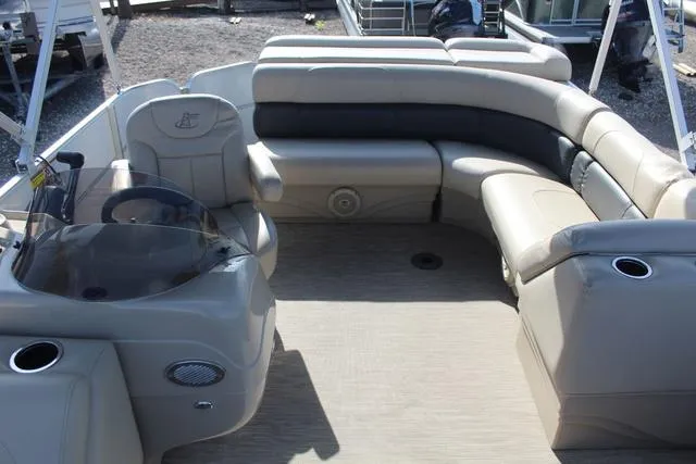 Slide: The Image of 2019 Misty Harbor Adventure CF A-1885CF pontoon boat interior with beige seating and helm. - 16