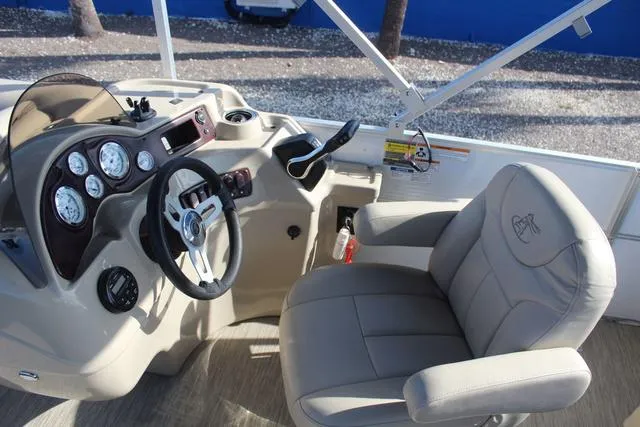 Slide: The Image of 2019 Misty Harbor Adventure CF A-1885CF boat cockpit with steering wheel and gauges. - 18