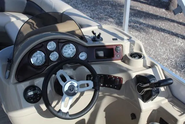 Slide: The Image of 2019 Misty Harbor Adventure CF A-1885CF boat dashboard with steering wheel and control panel. - 19