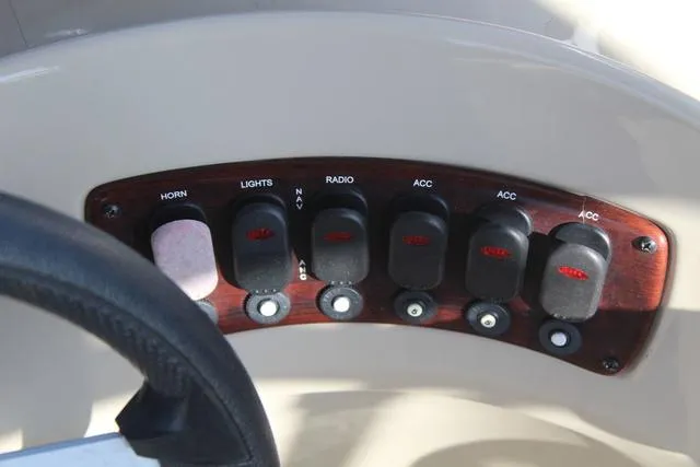 Slide: The Image of Control panel of 2019 Misty Harbor Adventure CF A-1885CF boat with labeled switches. - 21