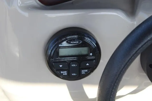 Slide: The Image of Control panel of 2019 Misty Harbor Adventure CF A-1885CF boat with power and volume buttons. - 23
