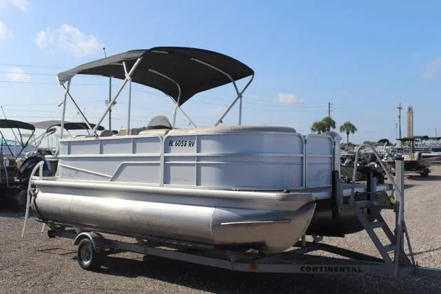 Slide: The Image of 2019 Misty Harbor Adventure CF A-1885CF pontoon boat on trailer, with canopy, outdoors. - 3