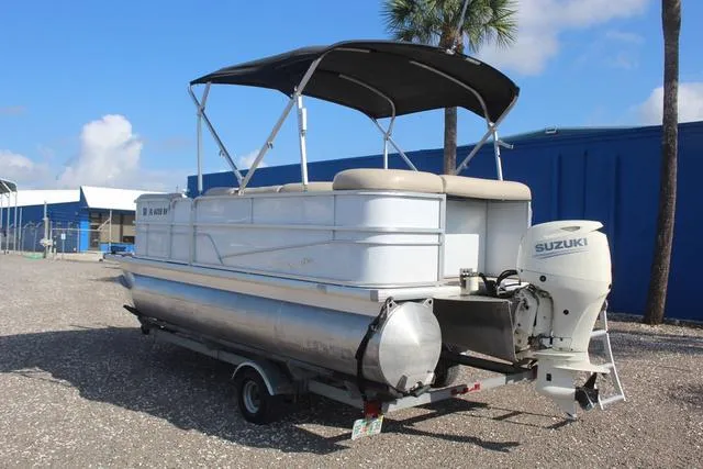 Slide: The Image of 2019 Misty Harbor Adventure CF A-1885CF pontoon boat with Suzuki outboard motor on trailer. - 6