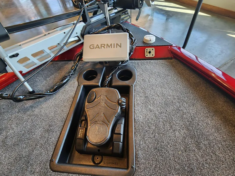 Slide: The Image of Foot pedal and Garmin device on 2025 Tracker Savage 215 boat deck. - 6