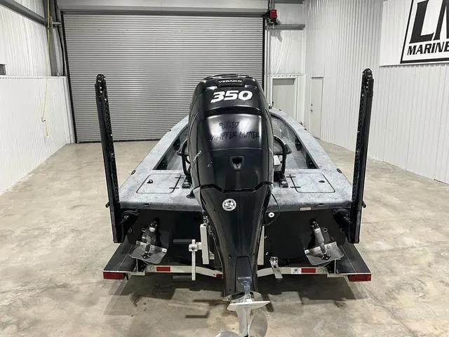 Slide: The Image of 2016 Haynie 25 Magnum boat with 350 Verado engine in a garage setting. - 3