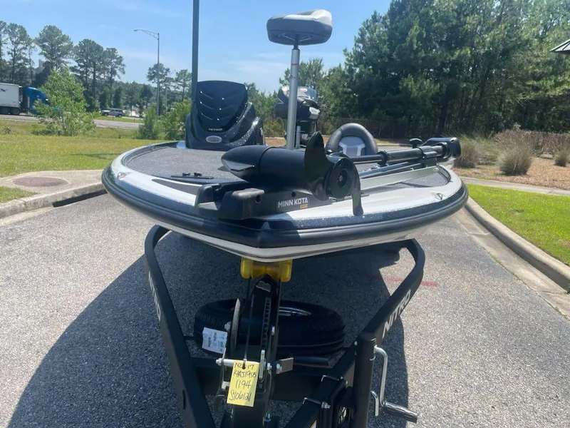 Slide: The Image of 2025 Nitro Z17 boat with Minn Kota trolling motor in a parking lot. - 3