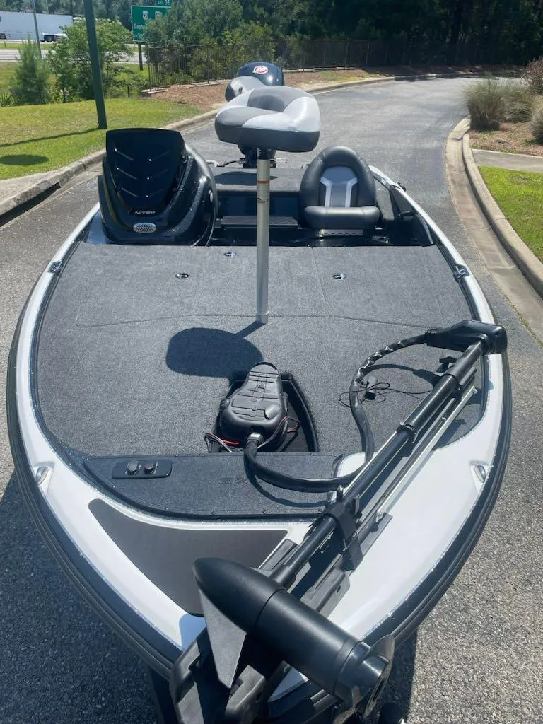 Slide: The Image of 2025 Nitro Z17 fishing boat with seating and equipment on a sunny day. - 4