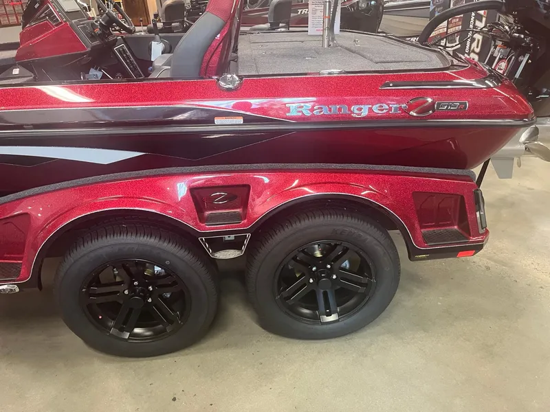 Slide: The Image of 2025 Ranger Z519R Cup-Equipped boat with dual black wheels and red detailing. - 3