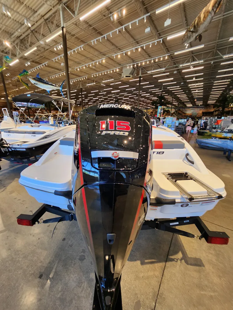 Slide: The Image of 2025 Tahoe T18 boat with Mercury 115 engine displayed in a showroom. - 3