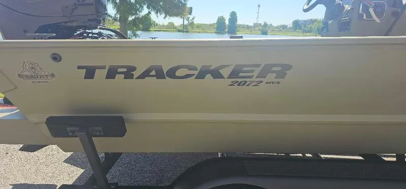 Slide: The Image of 2025 Tracker Grizzly 2072 CC boat side view with logo and model name. - 2