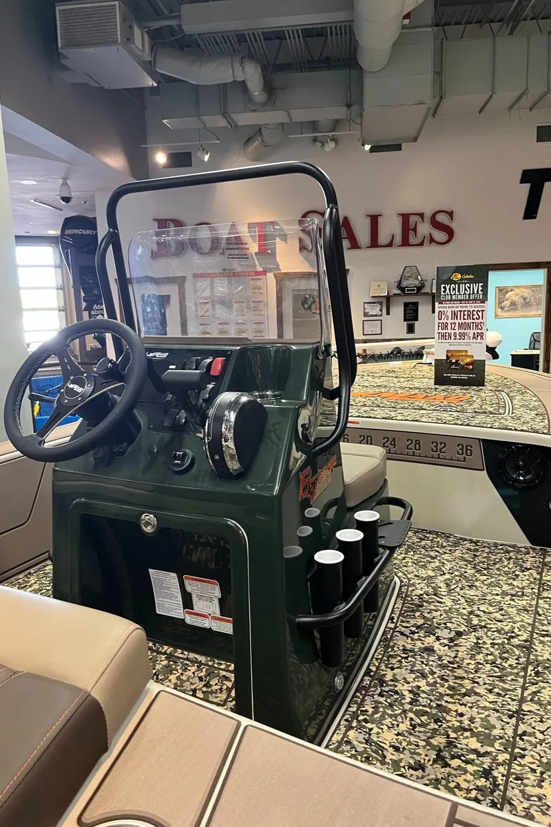 Slide: The Image of 2025 Mako 18 Pro Skiff Backwater Edition displayed in a boat sales showroom. - 3