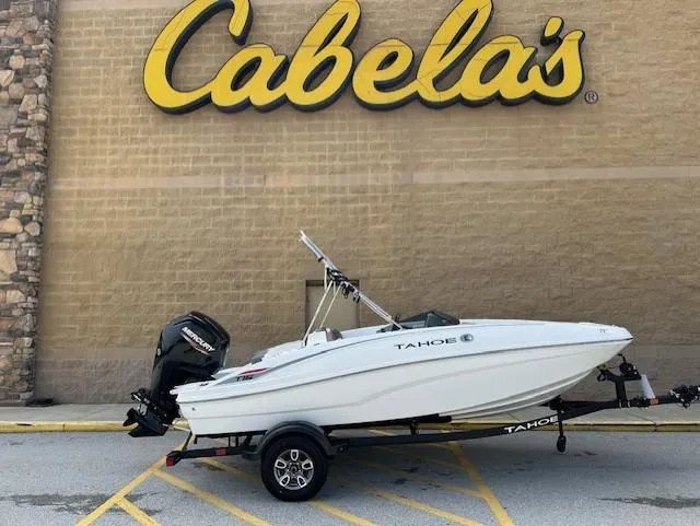 Slide: The Image of 2025 Tahoe T16 boat on trailer outside Cabela's store. - 5