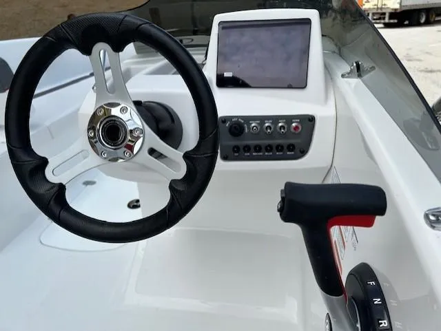 Slide: The Image of Steering console of 2025 Tahoe T16 boat with touchscreen and controls. - 8