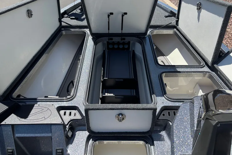 Slide: The Image of 2025 Ranger Z518 boat storage compartments open, showcasing spacious interior design. - 10