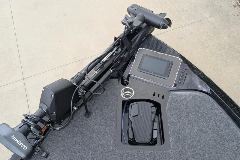 Slide: The Image of 2025 Ranger Z518 boat dashboard with Garmin electronics and foot pedal controls. - 8