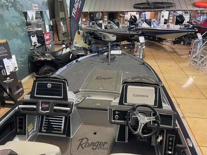 Slide: The Image of 2025 Ranger Z521R Cup-Equipped boat interior with Garmin navigation, displayed in showroom. - 7