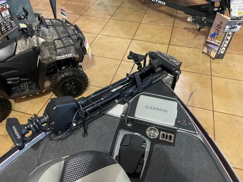 Slide: The Image of 2025 Ranger Z521R Cup-Equipped boat with Garmin electronics and Tracker ATV in showroom. - 8