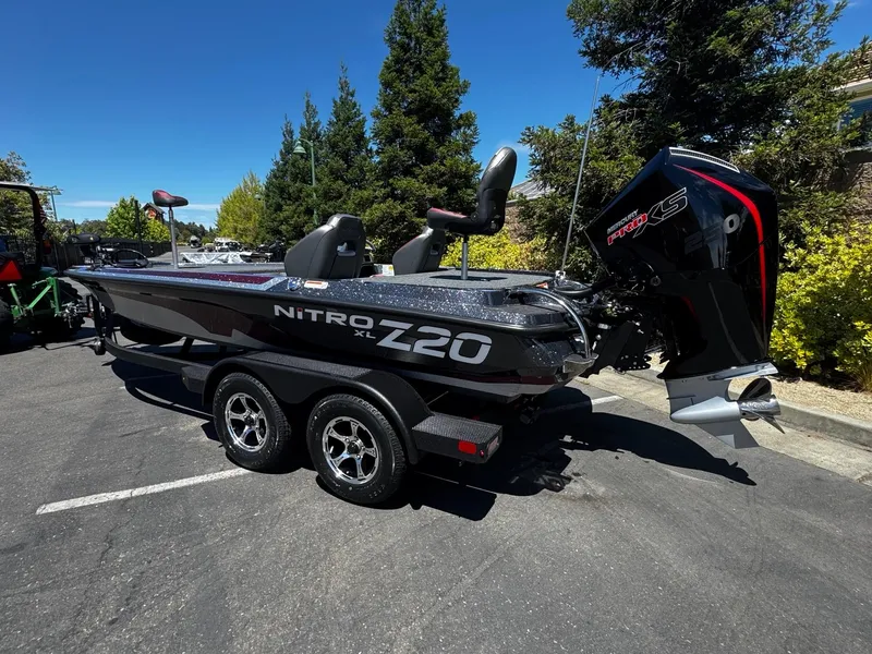 Slide: The Image of 2025 Nitro Z20 XL Pro boat with Mercury Pro XS engine on trailer. - 1