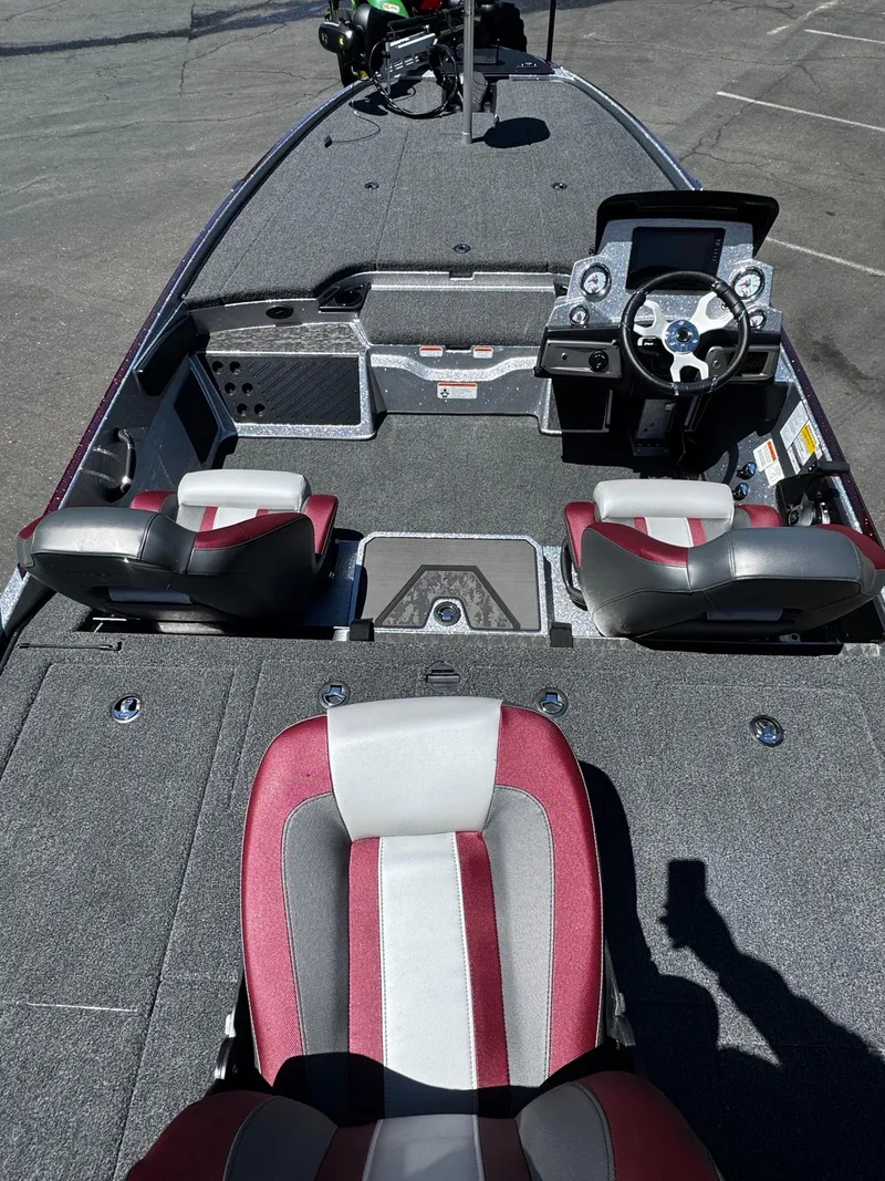 Slide: The Image of 2025 Nitro Z20 XL Pro boat interior with modern seating and steering console. - 3