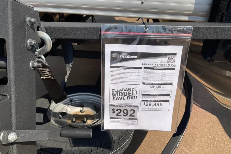 Slide: The Image of Trailer with Sun Tracker boat price tag, featuring 2025 Bass Buggy 16 XL Select model. - 73