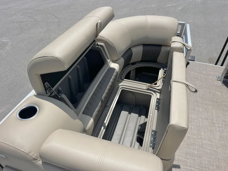 Slide: The Image of 2025 Sun Tracker Party Barge 20 DLX seating with storage compartments and cup holder. - 10