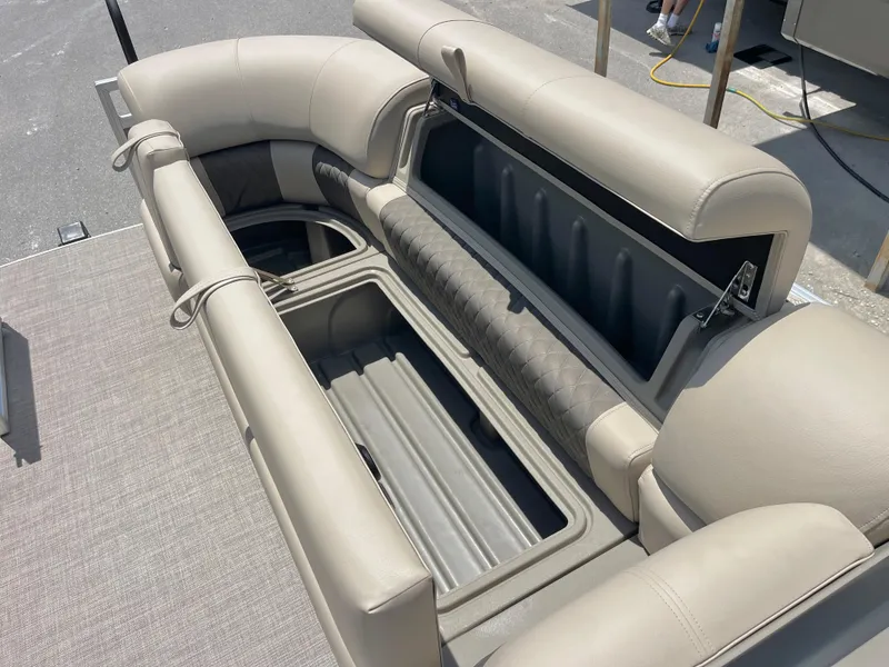 Slide: The Image of 2025 Sun Tracker Party Barge 20 DLX seating with open storage compartments. - 11