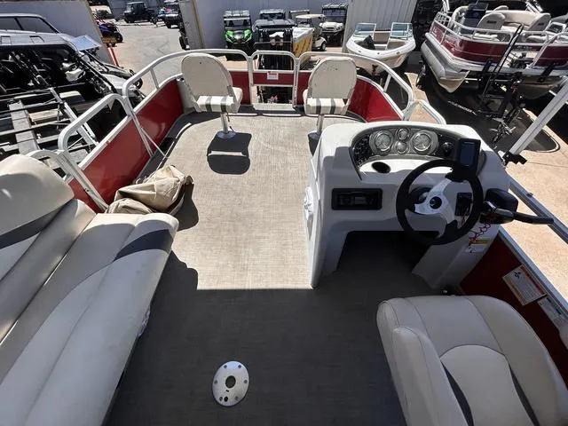 Slide: The Image of 2015 SunCatcher V20 F pontoon boat interior with seating and steering console. - 13