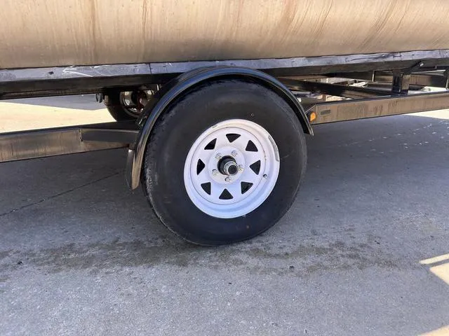 Slide: The Image of Trailer wheel of a 2015 SunCatcher V20 F on concrete surface. - 3
