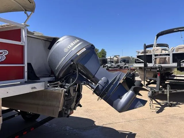 Slide: The Image of 2015 SunCatcher V20 F boat with Yamaha outboard motor in a marina setting. - 5
