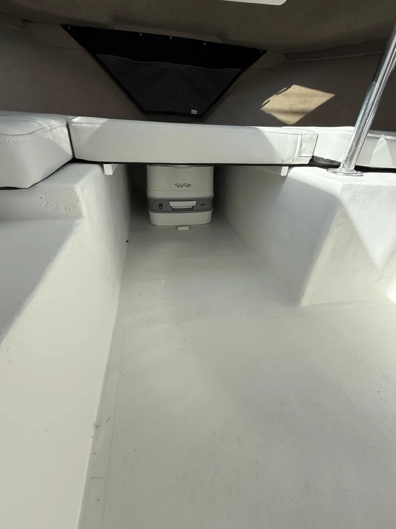 Slide: The Image of 2025 Parker 2120 Sport Cabin interior with seating and storage area. - 10