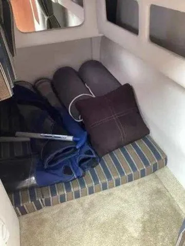 Slide: The Image of Interior cabin of 2015 Crownline 264 CR boat with cushions and storage. - 15