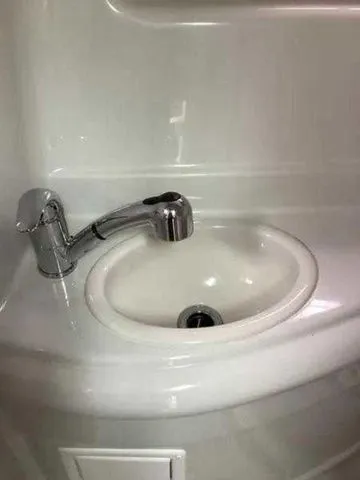 Slide: The Image of 2015 Crownline 264 CR boat bathroom sink with modern faucet. - 20