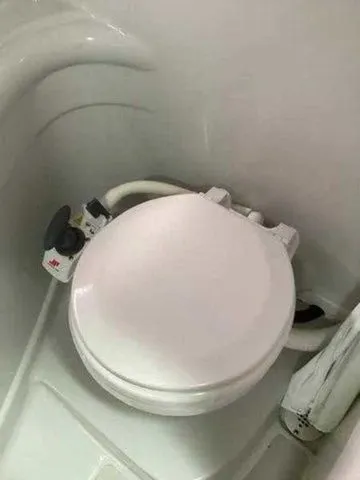 Slide: The Image of Boat bathroom with compact toilet in 2015 Crownline 264 CR model. - 31