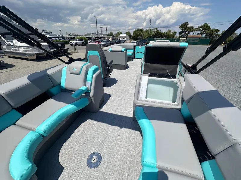 Slide: The Image of 2025 Berkshire 23RFX STS 3.0 pontoon boat with spacious seating and open storage compartment. - 11