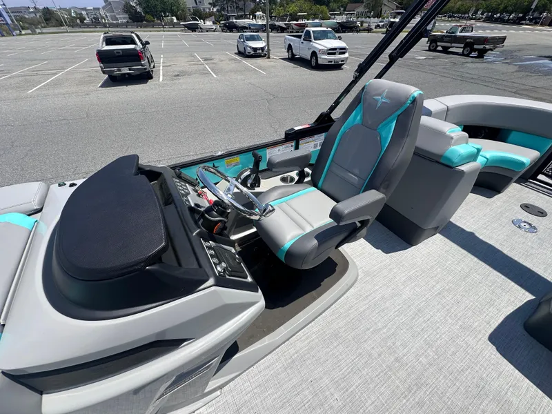 Slide: The Image of 2025 Berkshire 23RFX STS 3.0 boat interior with modern helm and seating. - 9