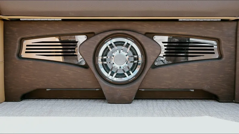 Slide: The Image of 2025 Tahoe Pontoon LTZ Cruise Rear Bench speaker system with sleek design and metallic accents. - 12