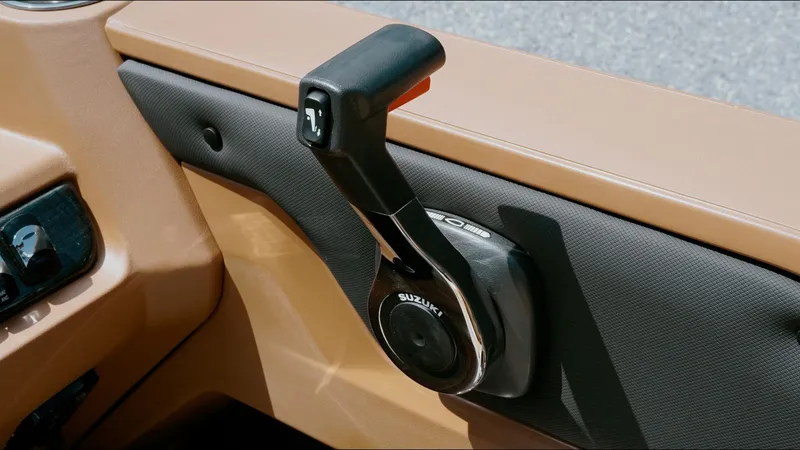 Slide: The Image of Throttle control of 2025 Tahoe Pontoon LTZ Cruise Rear Bench boat. - 17