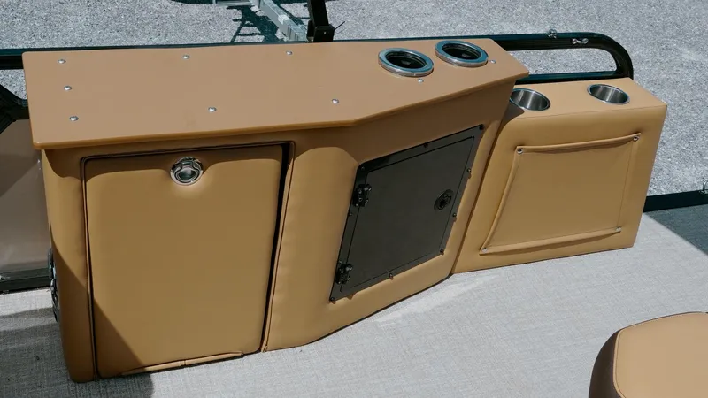Slide: The Image of 2025 Tahoe Pontoon LTZ Cruise Rear Bench with tan storage compartments and cup holders. - 22