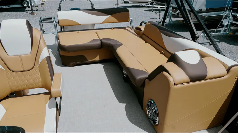 Slide: The Image of 2025 Tahoe Pontoon LTZ Cruise Rear Bench with stylish tan and brown seating. - 23