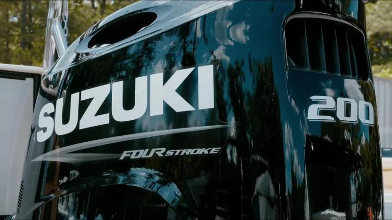 Slide: The Image of 2025 Tahoe Pontoon LTZ Cruise with Suzuki 200 Four Stroke engine, close-up view. - 25