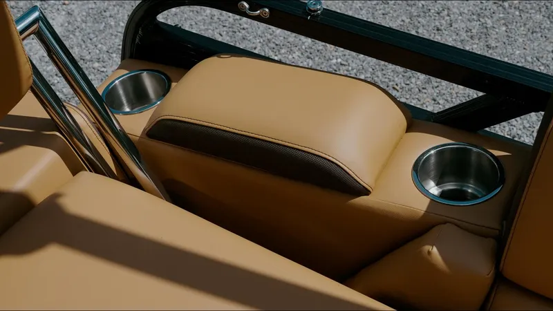 Slide: The Image of 2025 Tahoe Pontoon LTZ Cruise Rear Bench with cup holders and tan upholstery. - 28