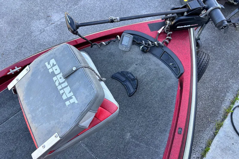 Slide: The Image of 1995 Sprint 277 boat deck with seat, trolling motor, and fish finder. - 2