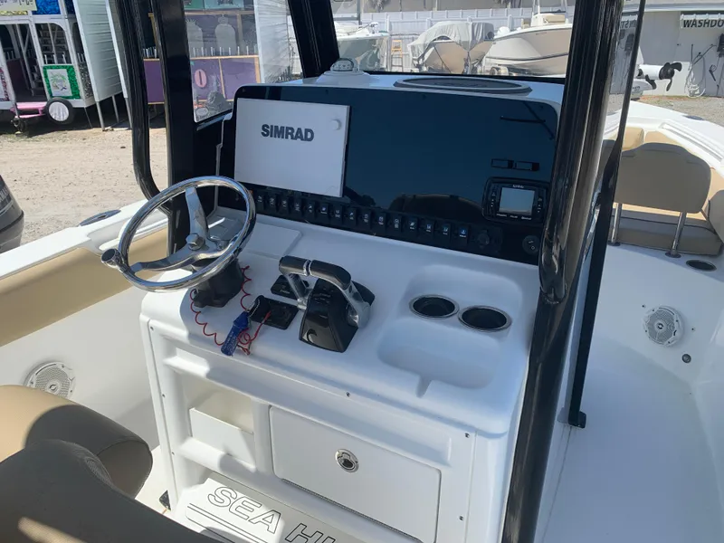 Slide: The Image of 2018 Sea Hunt Gamefish 27 helm with Simrad electronics and forward seating. - 13