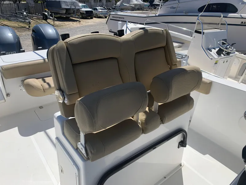 Slide: The Image of 2018 Sea Hunt Gamefish 27 boat with forward seating and dual cushioned chairs. - 14