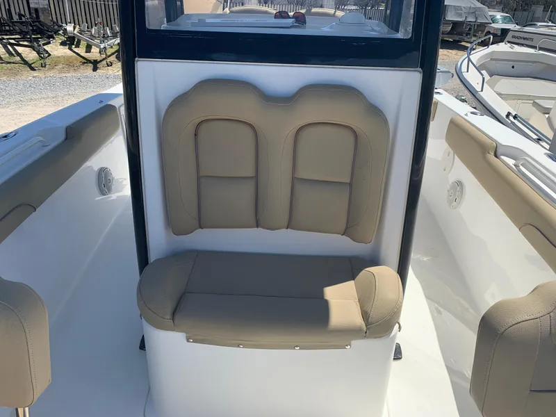 Slide: The Image of 2018 Sea Hunt Gamefish 27 Forward Seating interior with tan cushioned seats. - 19